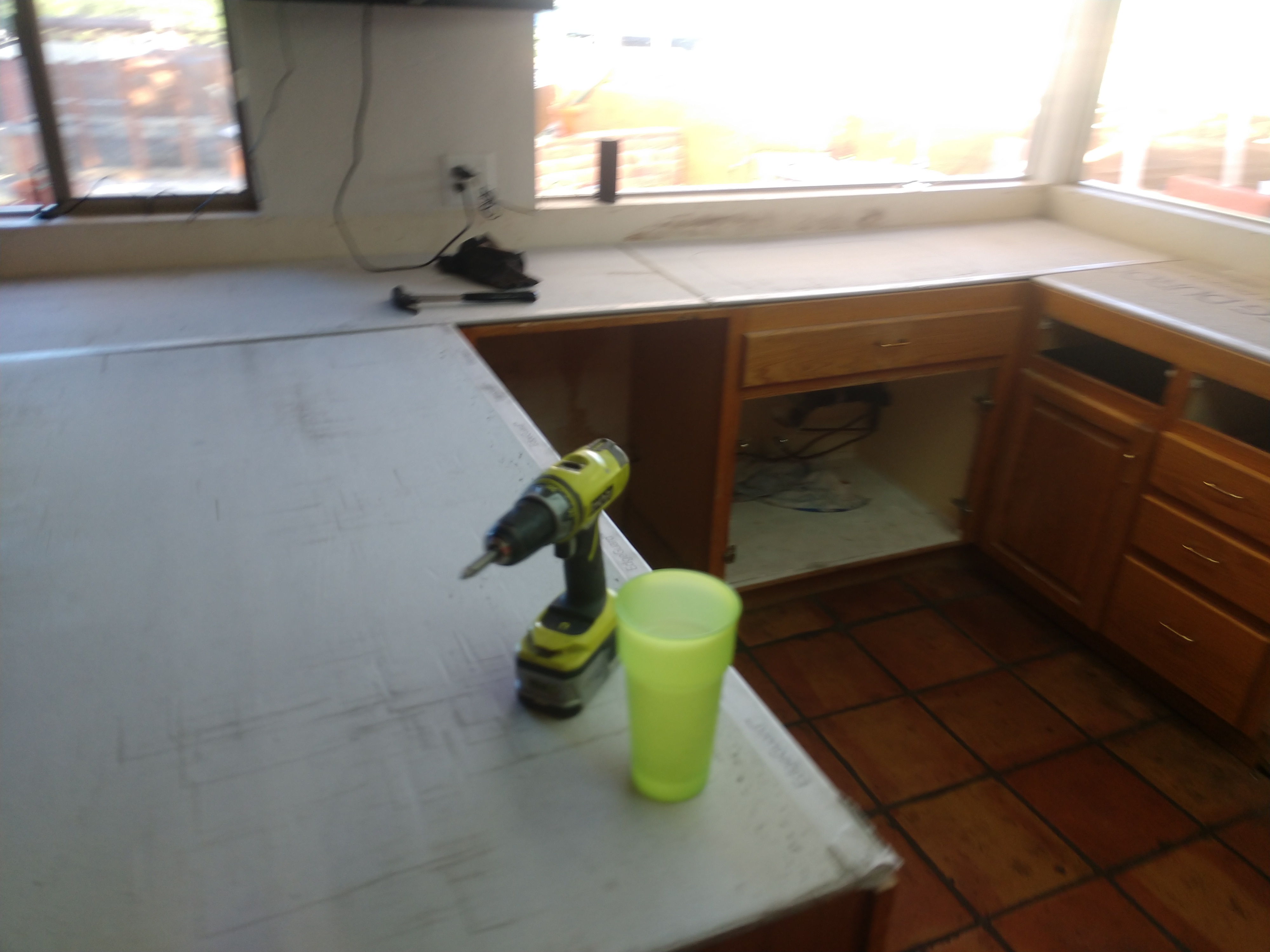 L-shaped kitchen countertop installation in progress