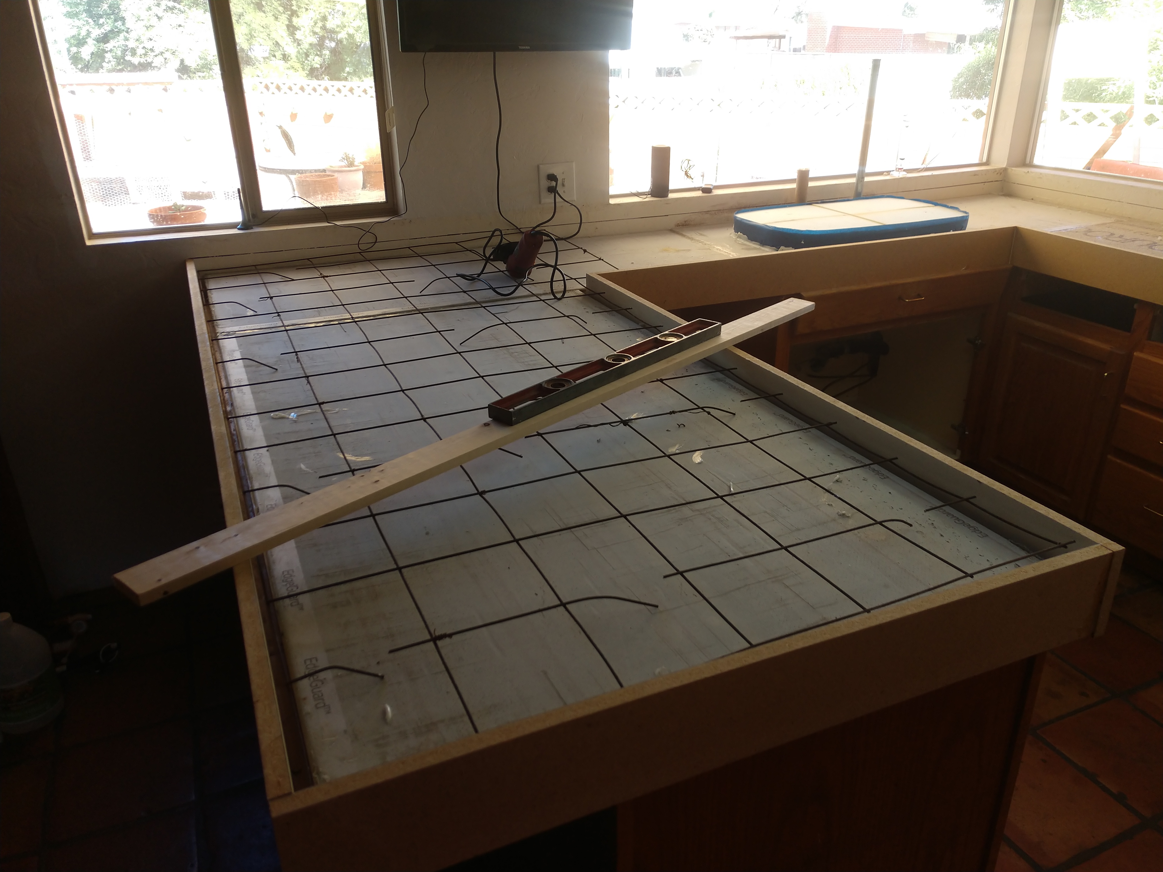 Tile layout template on concrete countertop