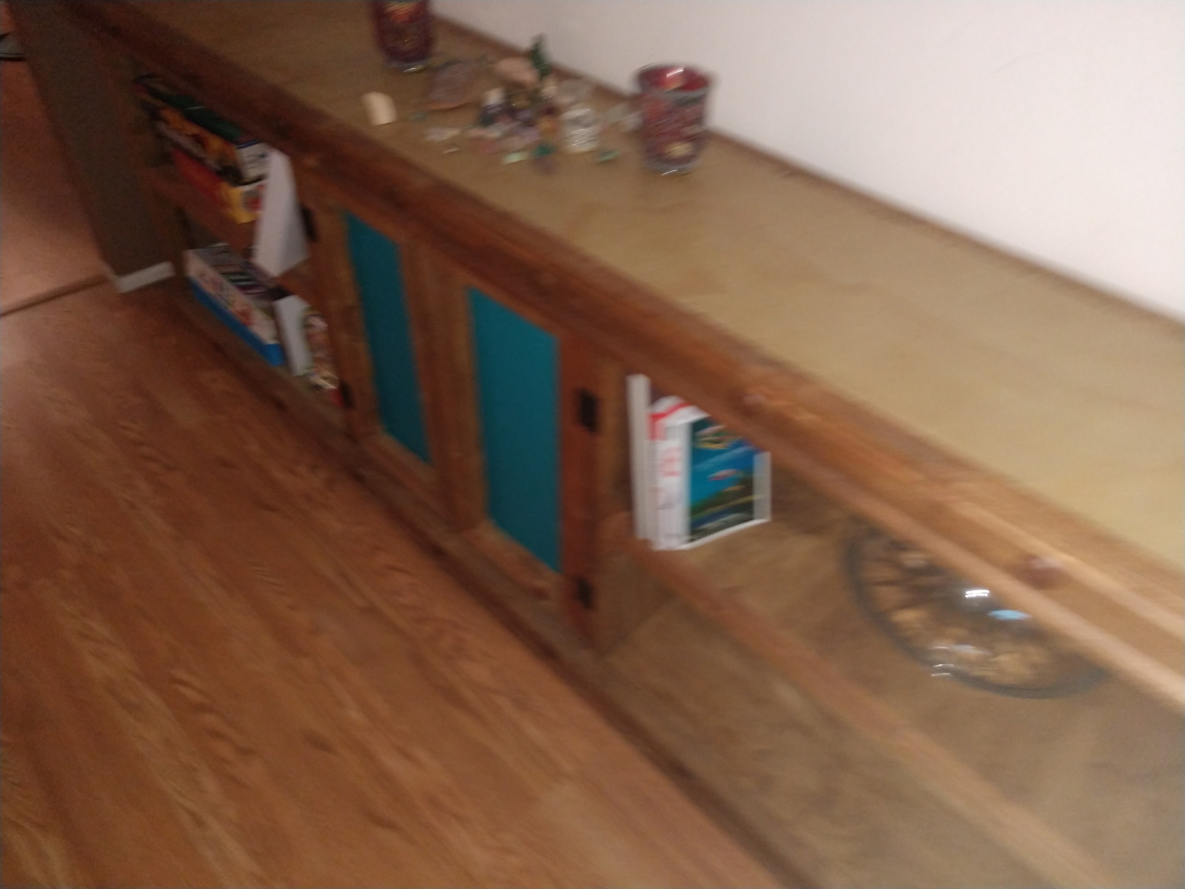 Finished custom media console with turquoise accents