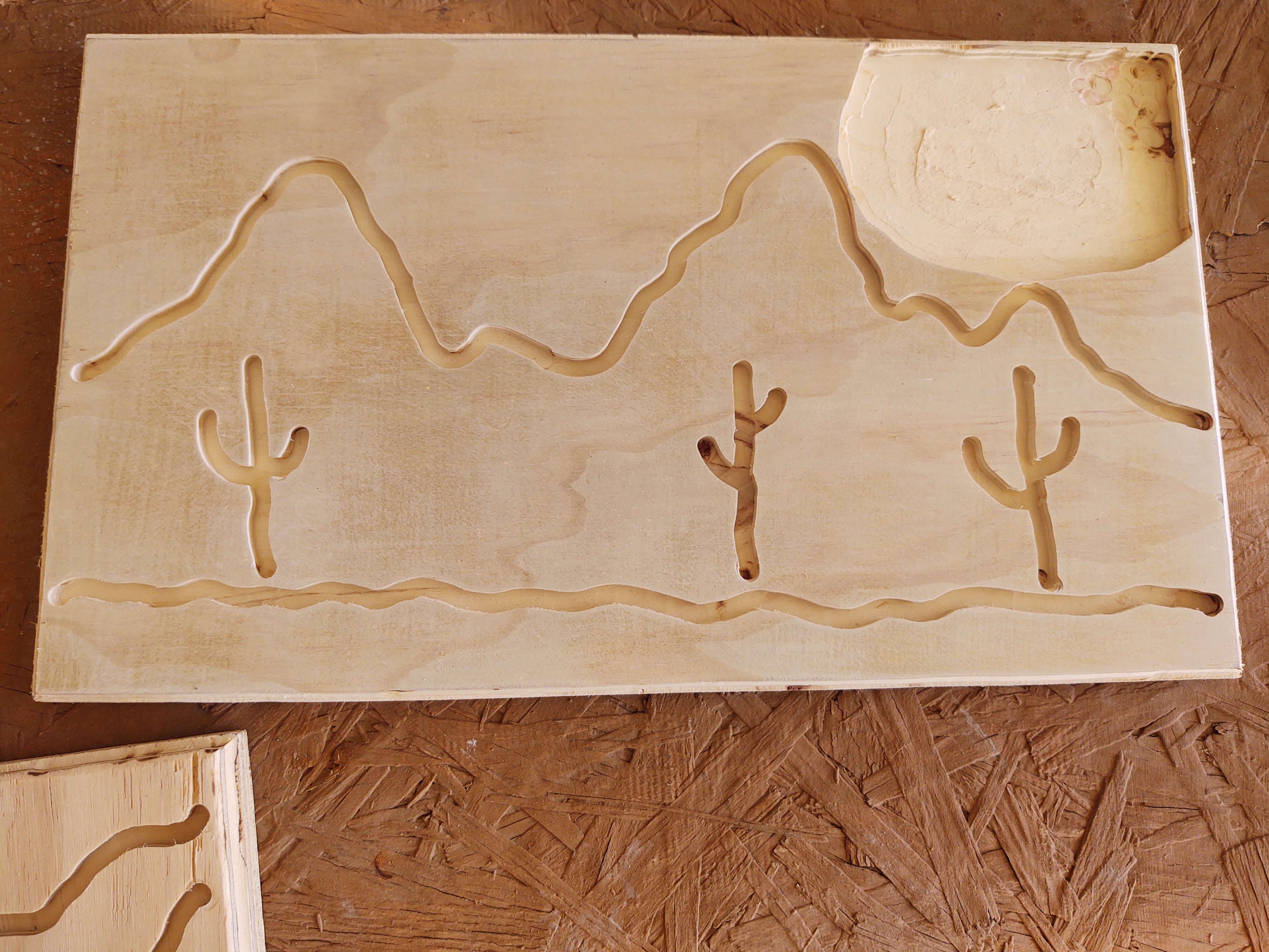 Routed mountain scene with saguaros